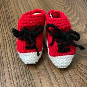 Knitted Christmas baby booties.